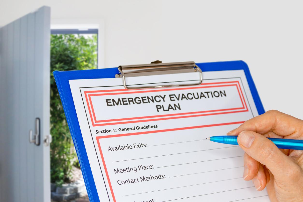 Hand writing emergency evacuation plan